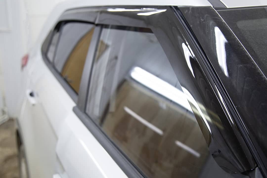 Rain guards installed on car windows